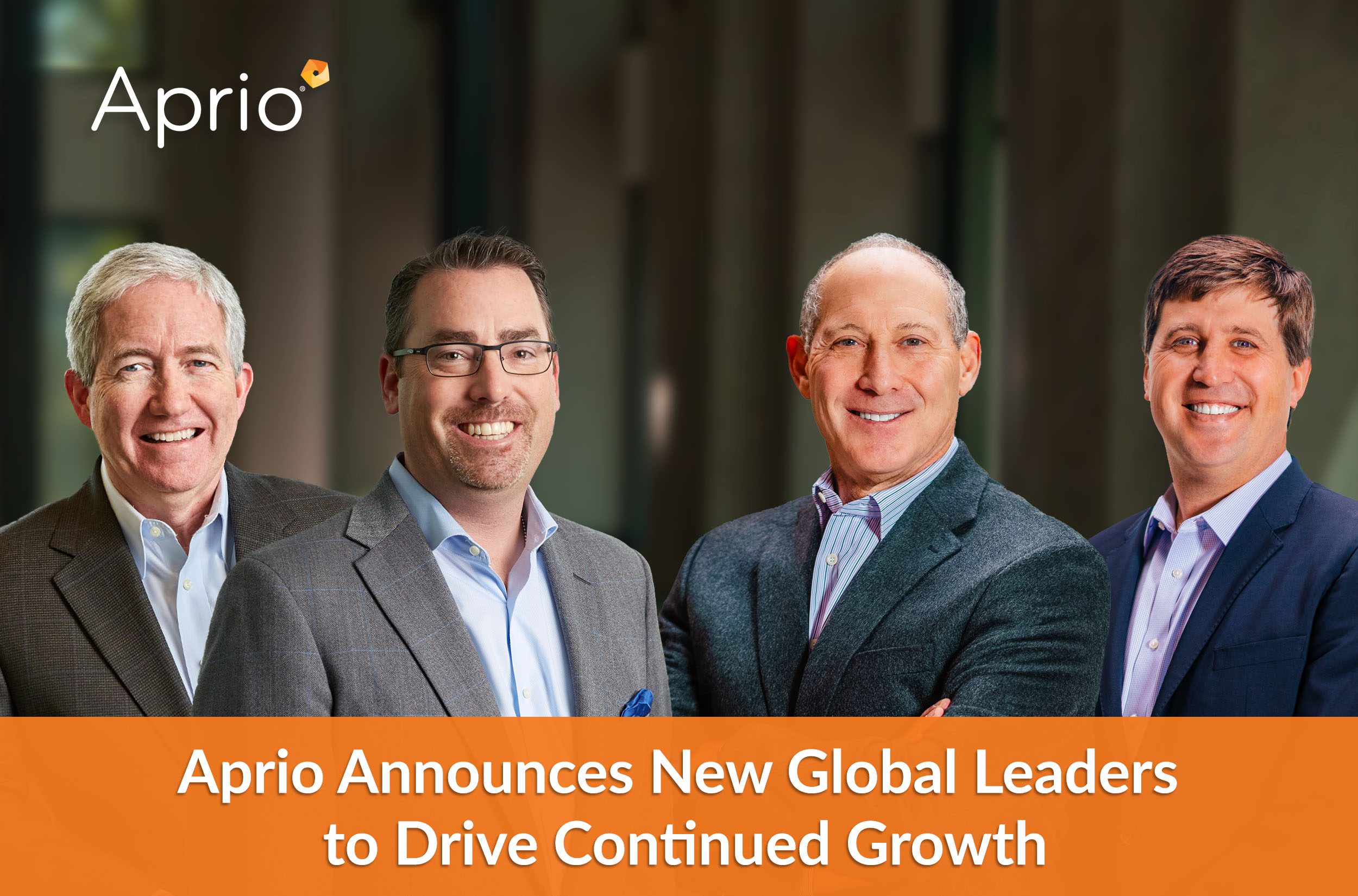 Four men in business attire stand in front of a blurred background. Text reads: Aprio Announces New Global Leaders to Drive Continued Growth.