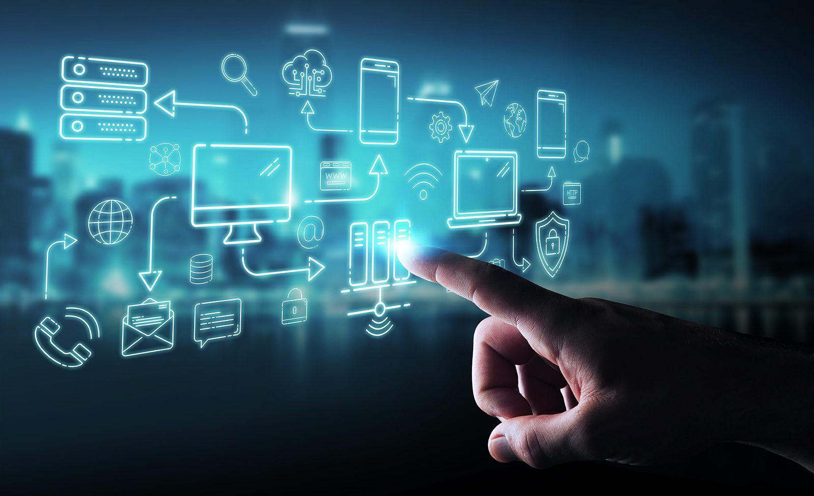 A hand points at a virtual display with digital icons representing cloud computing, data servers, smartphones, laptops, and network connections over a blurred cityscape background.