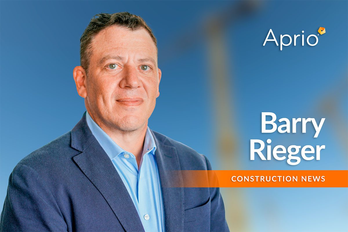 A man in a blue blazer stands in front of a blue background with the text Aprio, Barry Rieger, and Construction News.
