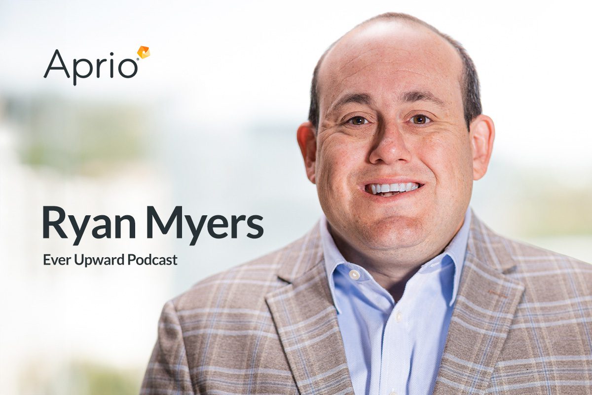 A man in a plaid blazer and blue shirt smiles at the camera. Text on the image reads: Aprio, Ryan Myers, Ever Upward Podcast. A blurred background is visible.