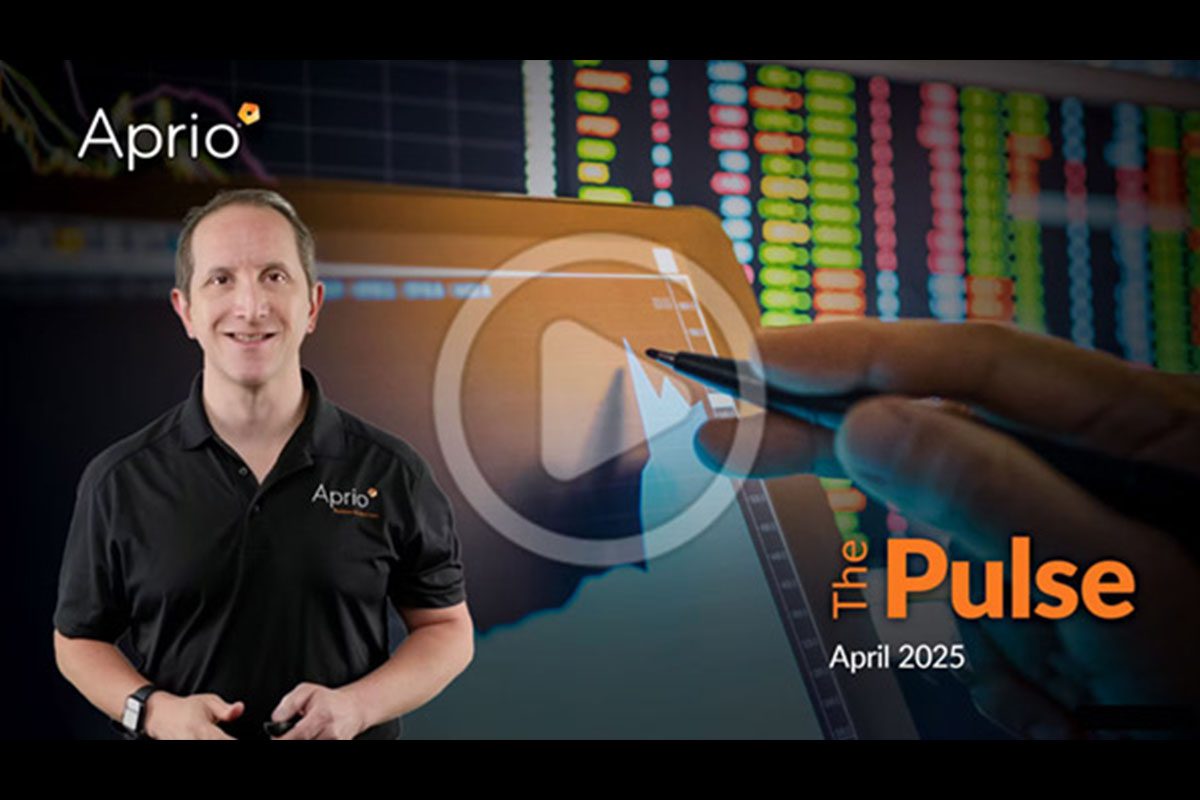 A man in an Aprio shirt stands beside a digital graph and stock market data, with the text The Pulse April 2025 and a play button overlayed on the image.